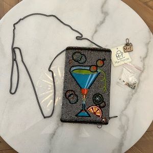 Beautiful small cross body or clutch. Brand new authentic Mary Francis with tags